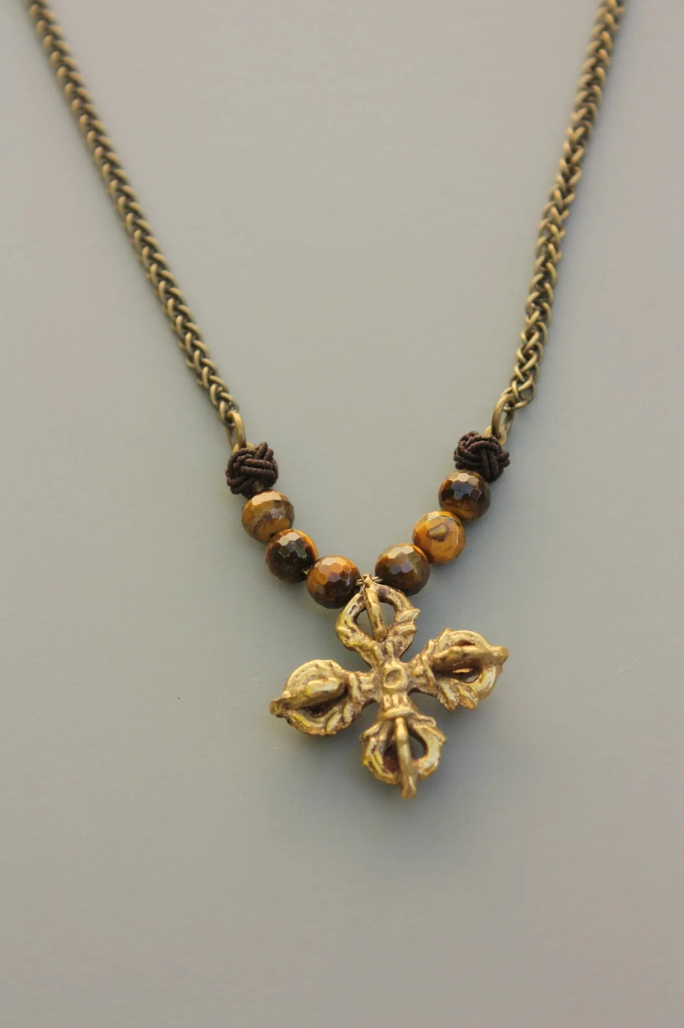 Javitri Faceted Tiger eye and Brass Buddhist cross Necklace